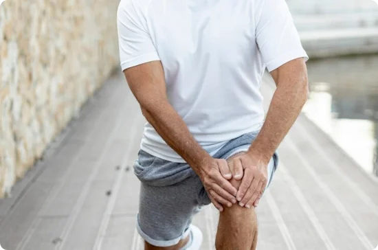 Man holding his knees